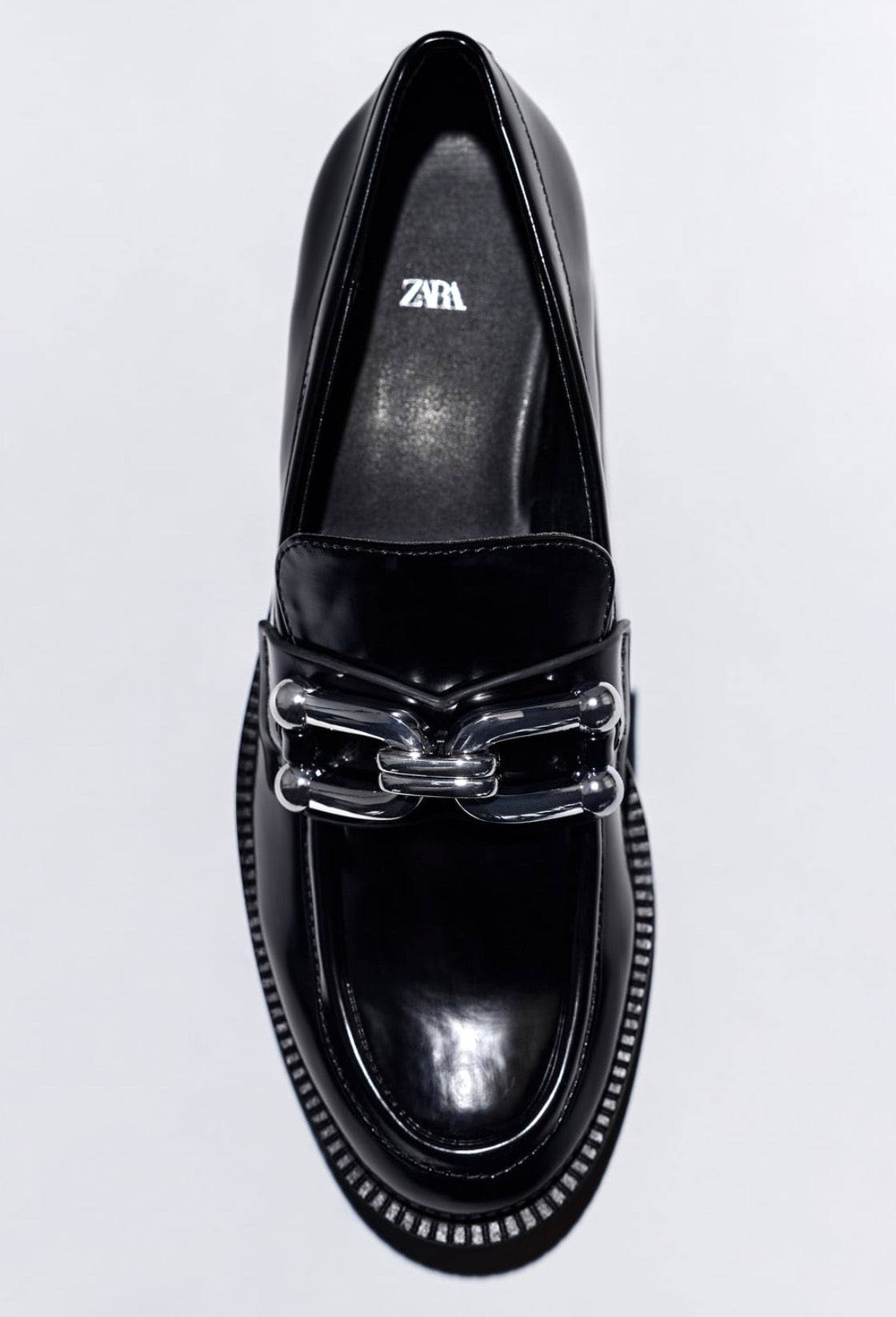 MOCASSINI CON SUOLA TRACK E ORNAMENTO